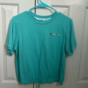 Teal Champion cropped shirt.